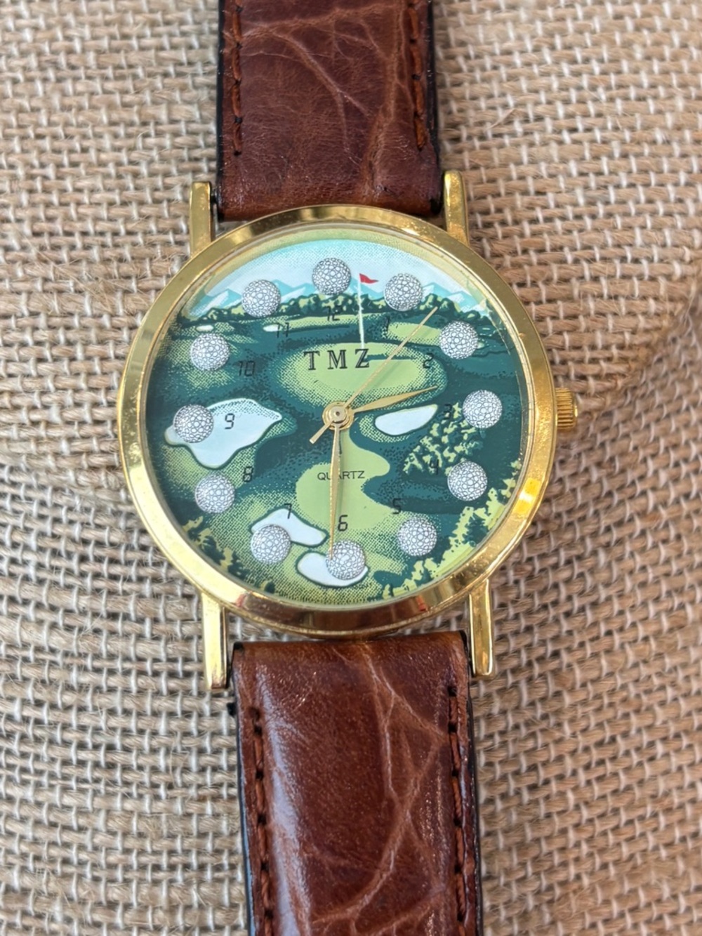 TMZ Golf-Themed Gold Tone Watch with Brown Leather Strap
